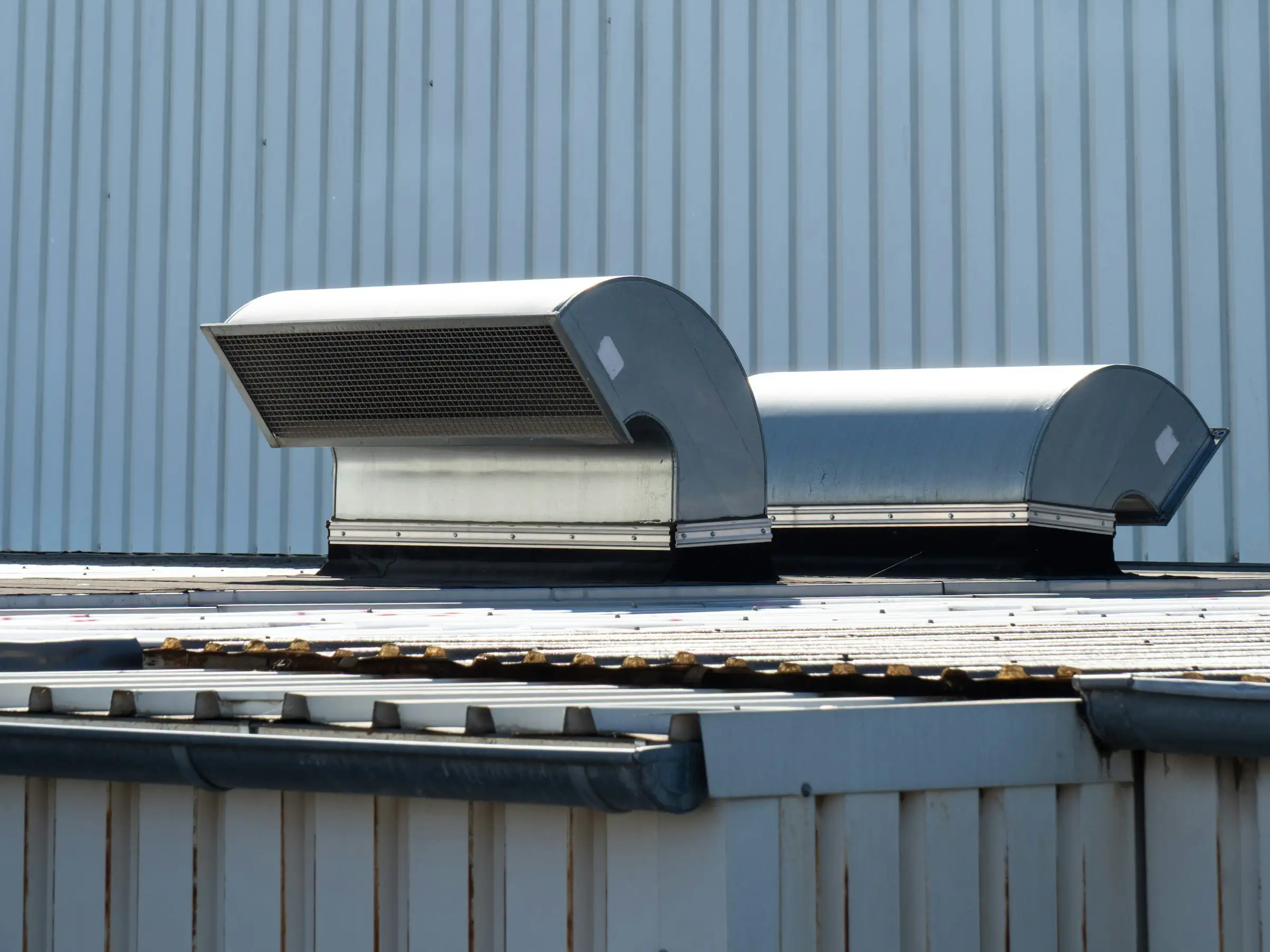 Metal commercial roof with rooftop vents
