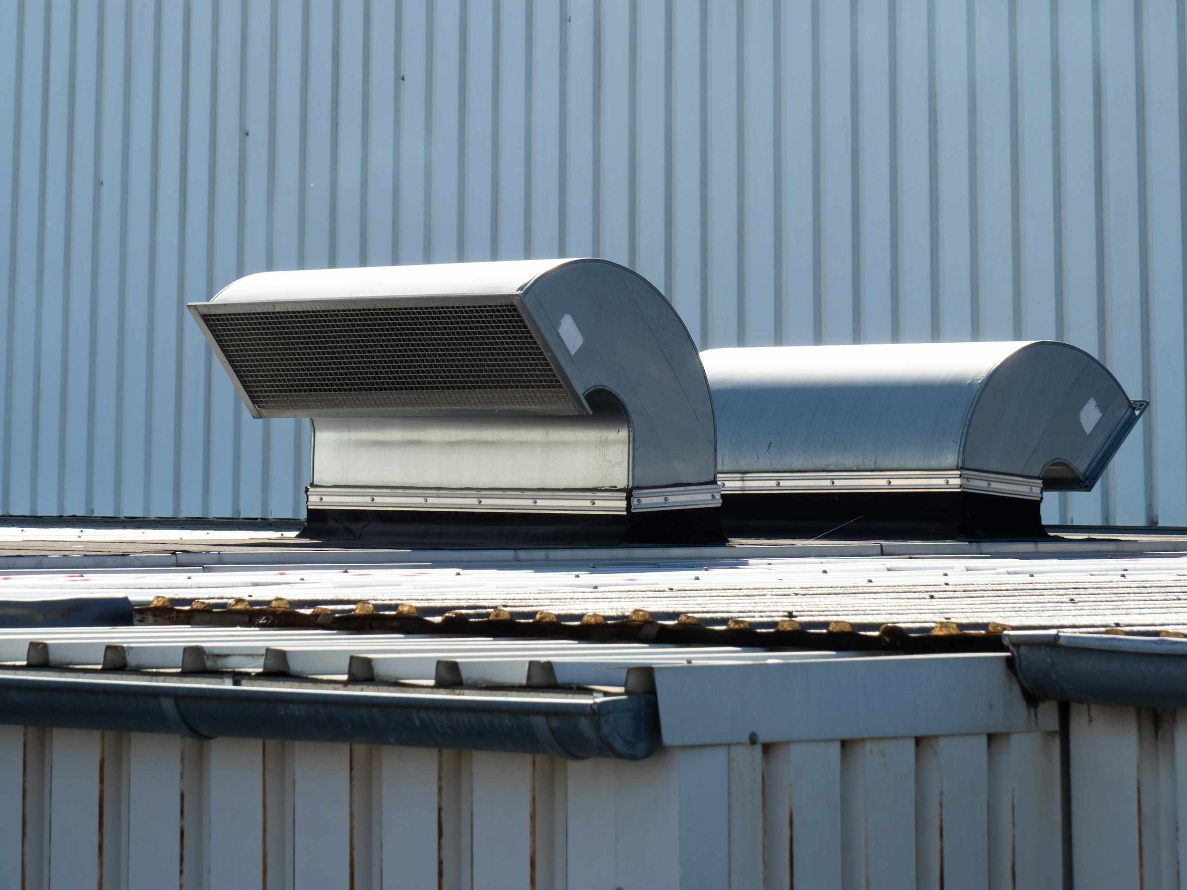 Metal commercial roof with rooftop vents